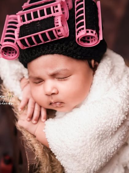 A slightly different angle of the newborn spa session, capturing the serene expression of the sleeping baby.