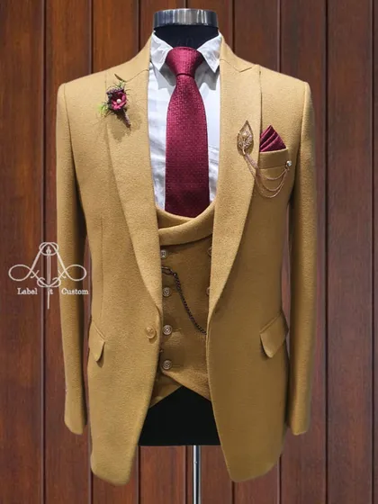 It's time to polish your style. This mustard yellow three-piece suit is for the man who wants to be the best-dressed in the room. A bold choice for a confident gentleman.
