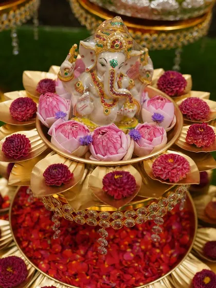 I pay a lot of attention to the details. This Ganesha idol placed on a brass lotus stand with fresh flowers is a centerpiece that brings blessings and beauty to the occasion.