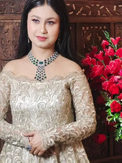The same ivory off-shoulder gown, this time styled with a statement emerald and diamond necklace. This shows how you can accessorize my outfits to make them your own.