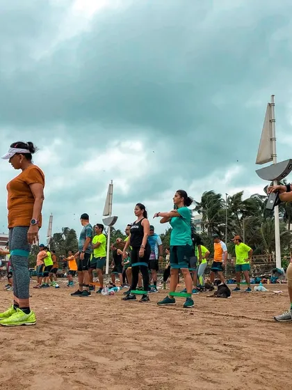 Using resistance bands on the beach to add an extra challenge to our strength training. The unstable surface of the sand engages more muscles, making every exercise more effective.