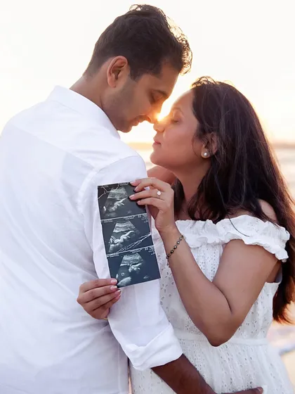 The first hello. I specialize in creative and heartfelt announcement photos, like this sunset beach session in Mumbai. We can use ultrasound pictures, baby shoes, or other personal touches to share your exciting news with the world.