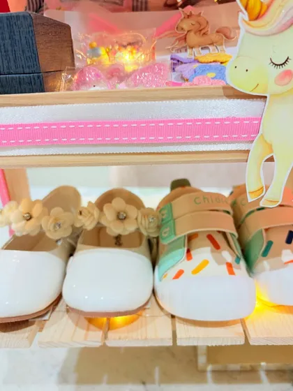 The tiniest, most adorable booties and shoes, perfectly displayed as part of the first birthday gift.