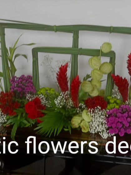 Another view of our modern, architectural centerpiece. The contrast between the structured green frames and the vibrant red flowers creates a visually striking design.