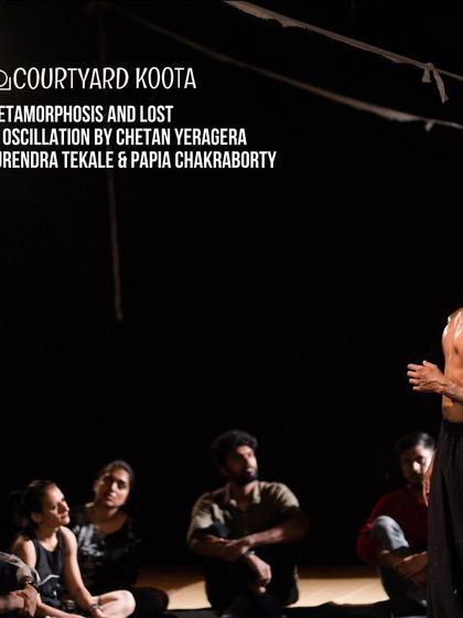 A striking image from the contemporary dance piece 'Metamorphosis and Lost in Oscillation'. The performance used the entire space, including the audience area, to create an immersive and thought-provoking experience.