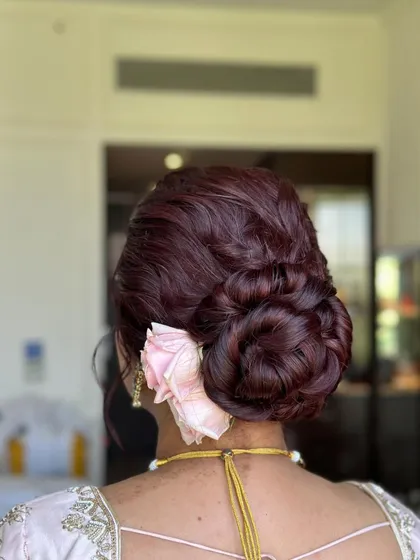 The final look of the burgundy bun, a stunning choice for a bride with colored hair.