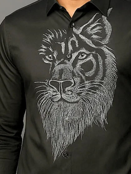 An extreme close-up of the lion's face, where every stitch is visible. This showcases the level of detail that goes into my bespoke embroidered shirts.