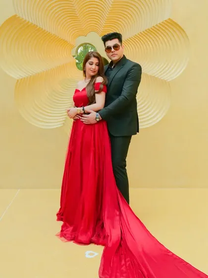 A glamorous pre-wedding portrait featuring a bold red gown with a dramatic train. We work with couples to create high-fashion looks that feel both modern and romantic, set against minimalist backdrops.