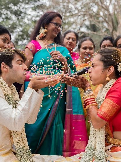 The 'talambralu' ritual, where the couple showers each other with rice and pearls, signifying abundance and happiness.