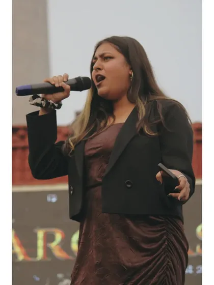 On stage, mid-sentence, engaging with the audience. I make sure to connect with people and make them feel like part of the show.
