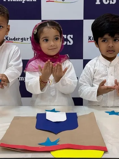 Praying for peace and happiness. These children are learning about Eid traditions in a way that is meaningful and easy for them to understand.
