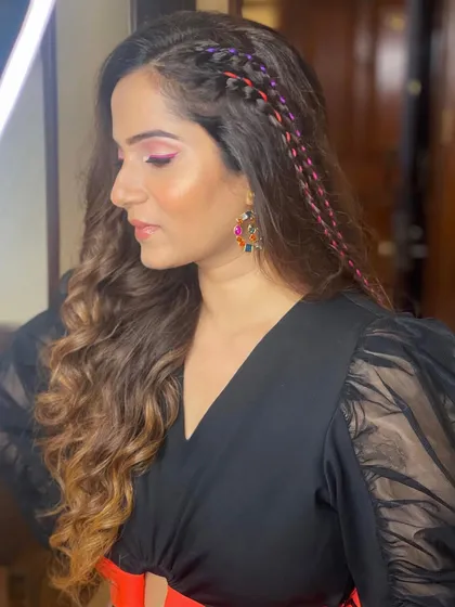 A fun and edgy look with a side braid woven with colorful threads, perfect for a themed party.