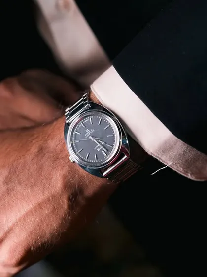 A close-up shot of the groom's classic timepiece.