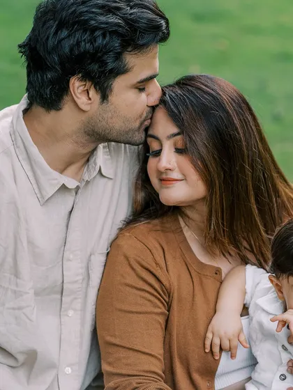 A tender moment between parents, with their son looking on. This was our third shoot together, and it's a joy to watch families grow.