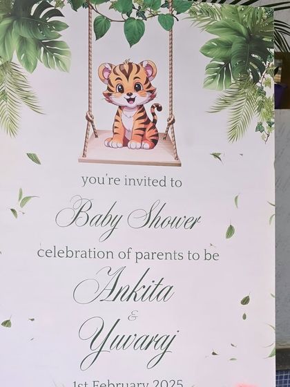 A cute welcome sign for a jungle-themed baby shower, featuring a tiger cub.