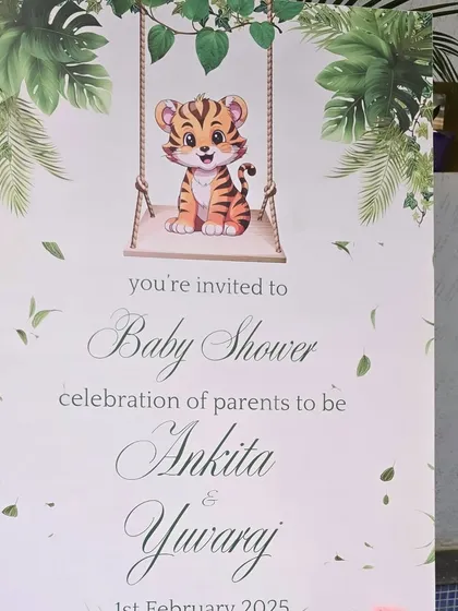 A cute welcome sign for a jungle-themed baby shower, featuring a tiger cub.