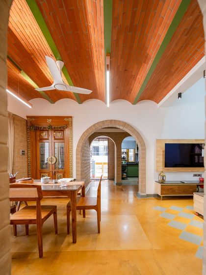 A view through an archway into the living and dining space.