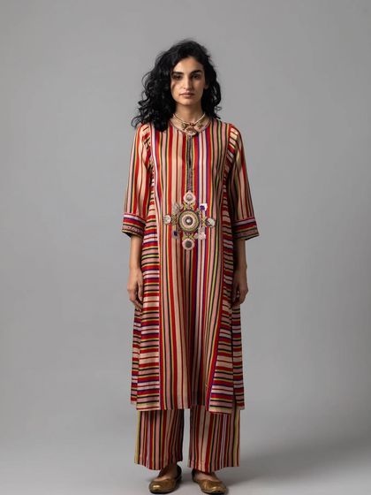 A full view of the multi-colored striped kurta and palazzo set, a perfect example of contemporary ethnic wear.