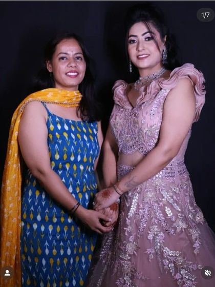 A picture of me with a happy client wearing the dusty pink engagement gown, showcasing the final look and a successful collaboration.