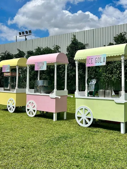 These pastel-colored food carts for popcorn, cotton candy, and ice gola were a huge hit at Zaynab and Amayrah's Candyland party, adding an interactive and fun element for all the guests.