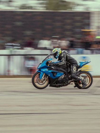 A blue BMW S1000RR, another top-tier superbike, speeding down the track. The competition between different manufacturers is always a major highlight.
