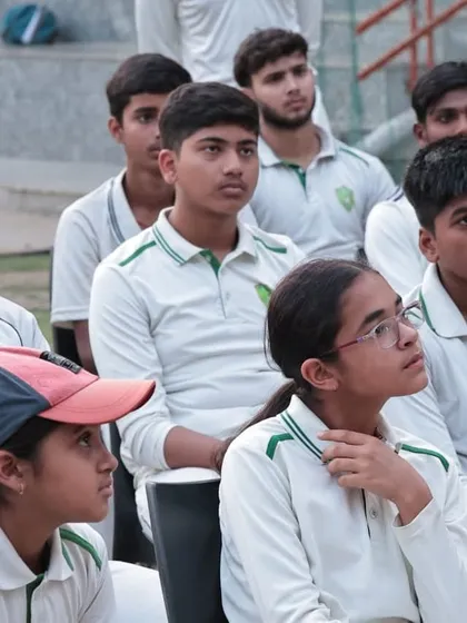 The focused faces of our young players, including boys and girls, during the sports psychology session. We teach them that mental resilience is just as crucial as technical skill in today's competitive cricket landscape.