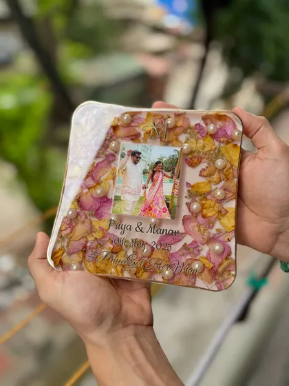 Holding this custom 6x6 inch resin block, you can really appreciate the details. The preserved flowers, pearls, and personalized text all come together to create a unique memory.