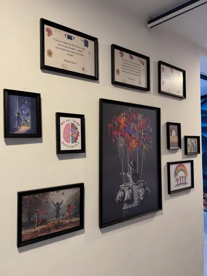 Every detail in our space is chosen with love to inspire curiosity and a feeling of belonging. This wall is a daily reminder for our children to dream big, think differently, and celebrate their unique selves.