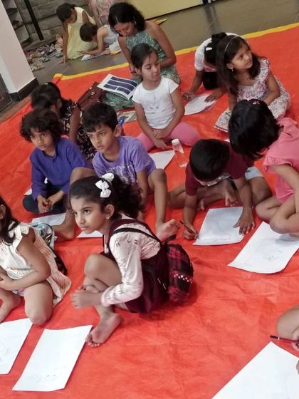 The kids are fully focused during the draw-along portion of our session with Priya Kuriyan. It's amazing to see them try their hand at illustrating a character from the book.