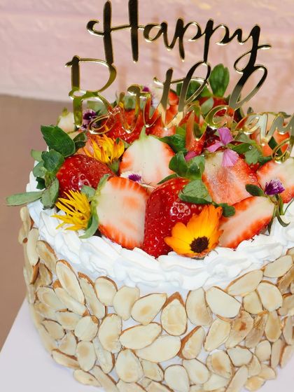 A close-up of our fresh strawberry and almond cake, a perfect treat during strawberry season.