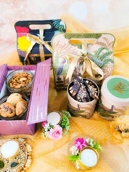 My Diwali gift hampers are all about beautiful packaging and delicious variety. This photo showcases a few options, from elegant boxes to festive bags, filled with handmade cookies, assorted nuts, and chocolate bark. I offer delivery across Mumbai and can also ship some items outstation.