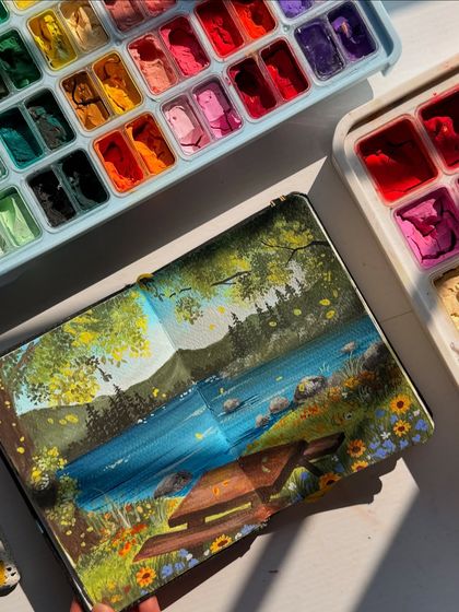 An overhead shot of the sketchbook painting and my gouache palette.