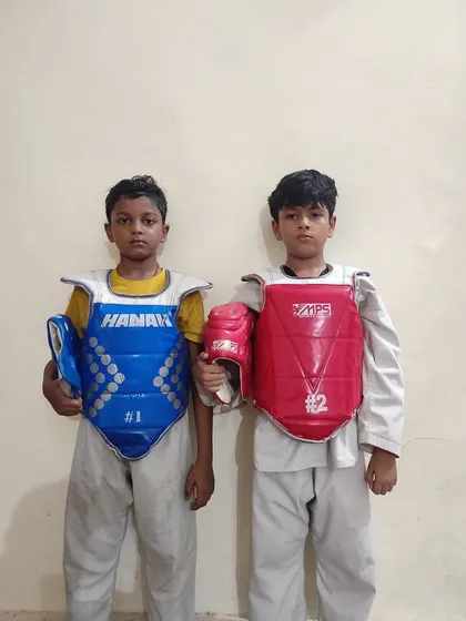 Two of my young fighters from the Tiger Taekwondo Academy, fully geared up and ready for action.