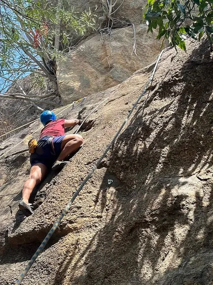 A climber works their way up a route during our 39th Intro Workshop. Even in the summer heat, the shade of the crag and the high spirits of the group make for a perfect day of climbing.