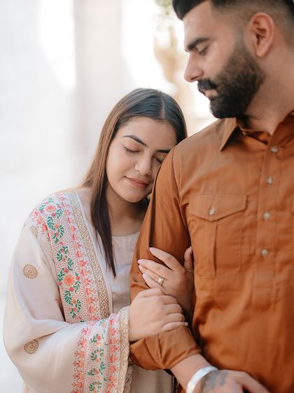 A tender and intimate portrait, capturing a quiet moment of connection amidst the historic lanes of Dubai.