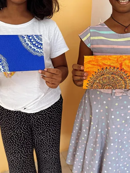 So much joy in these finished pieces. My students proudly showing off the beautiful Mandalas they created on textured paper during one of our kids art classes.