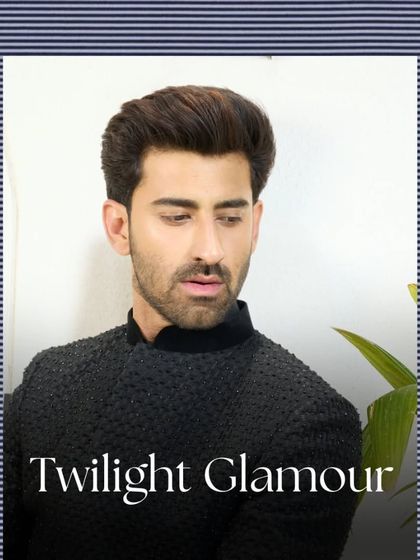 A close-up portrait showcasing the texture and sheen of the black Jodhpuri suit. This piece is designed for twilight glamour and evening sophistication.