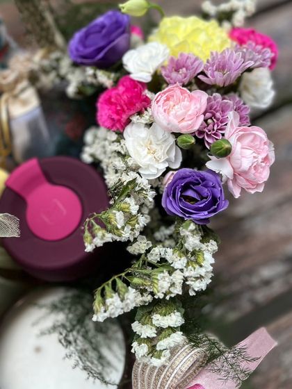 The beautiful, multi-colored floral arrangement that brings a touch of nature's healing energy to the gift.