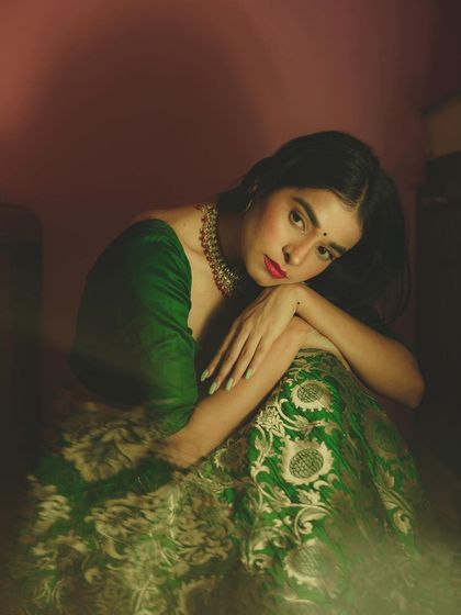 This portrait captures a moment of quiet contemplation. The soft lighting and the model's pose evoke a sense of vulnerability and grace, making it a deeply emotional and artistic shot.