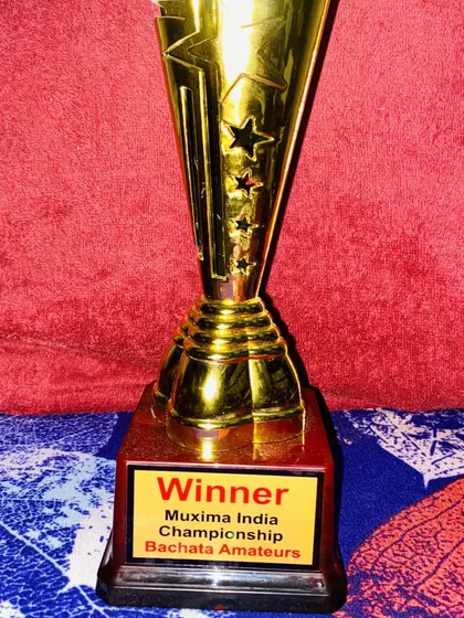 A moment of immense pride. This is my trophy for winning the Muxima India Bachata Championship. This achievement is a testament to the dedication and passion I bring to every class and performance.