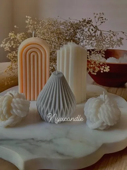 Launching my Christmas candle collection. This image showcases a variety of modern, sculptural shapes like the arch and knot candles, perfect for contemporary holiday decor.