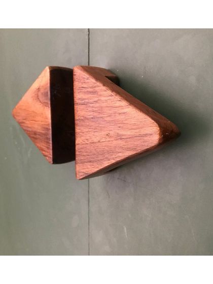 A custom-designed geometric wooden handle. Crafting unique hardware is one way I add a bespoke touch to a project, ensuring even the smallest details align with the overall design vision.