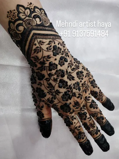 Another angle of the floral net design, showing how the pattern wraps perfectly around the hand, finished with a beautiful cuff at the wrist.