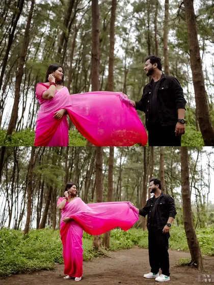 The vibrant pink of the saree against the green forest creates a stunning visual. This shot captures a classic romantic moment, with the groom holding the bride's saree pallu.
