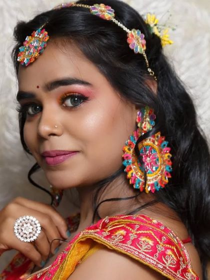 Another beautiful shot of the Haldi look, highlighting the matching floral ring and the bright, happy colors of the outfit.