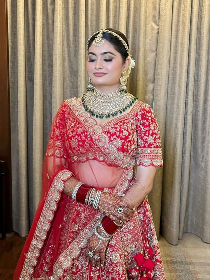 A beautiful smiling shot of Sonal. Her makeup is flawless, with a focus on glowing skin and defined eyes.