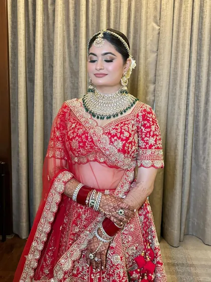 A beautiful smiling shot of Sonal. Her makeup is flawless, with a focus on glowing skin and defined eyes.