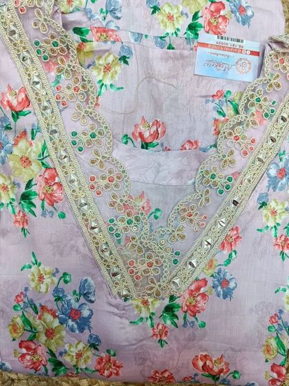 This beautiful lavender suit piece with delicate embroidery makes a wonderful Mother's Day gift. It's a gift of style and elegance.