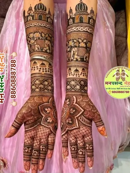 This intricate design features elephants in a procession on the forearms and a large floral mandala on the palms. The mix of motifs creates a rich and festive look.