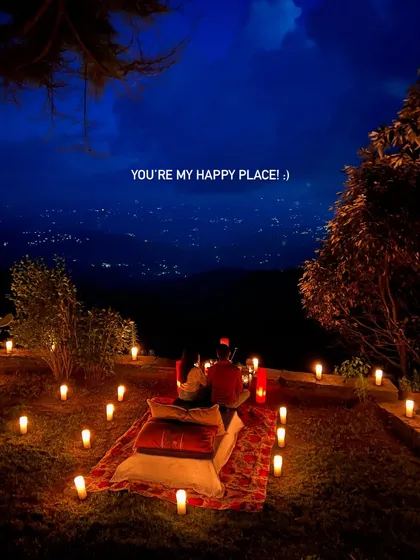 I believe your photoshoot should feel like a dream date. For this session, we created a magical, candlelit picnic overlooking the city lights at dusk. It’s about creating a happy place you can always look back on.
